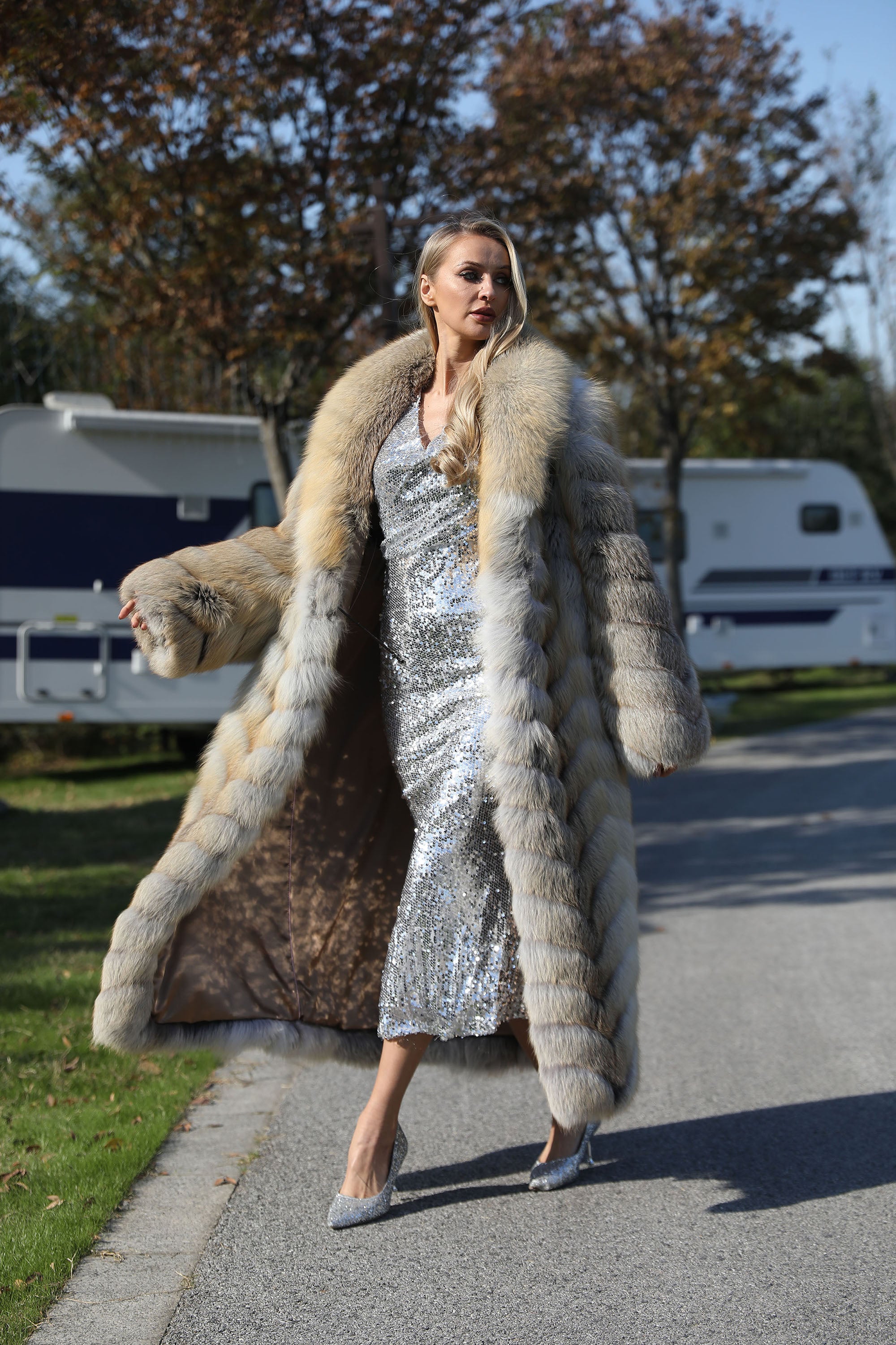 Women's real golden island fox fur long coat - model walking side view