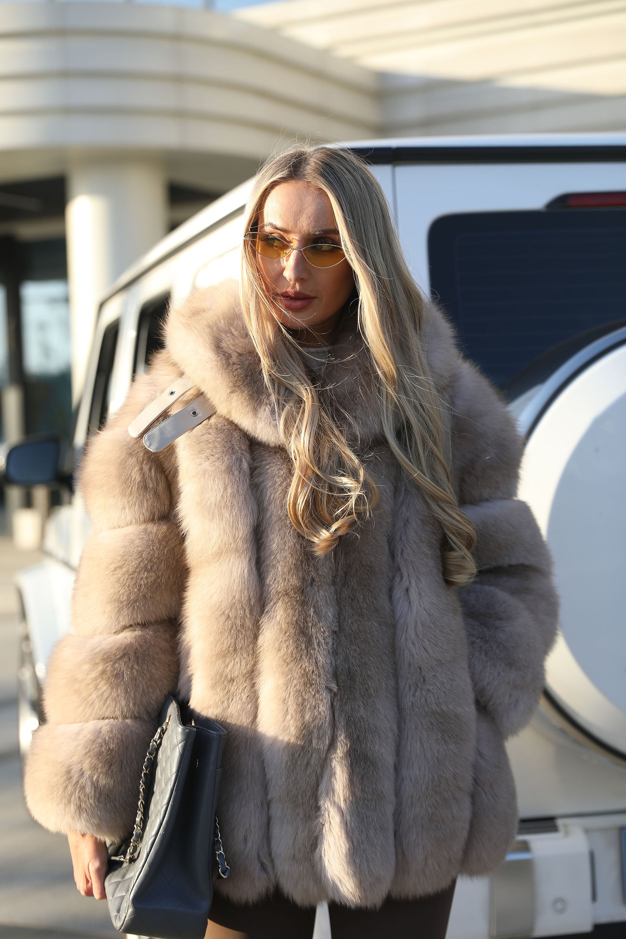 Women's Vertical-Stripe Fox Fur Oversized Coat with Banded Sleeves & Lapel Collar — Downtown Rhythm