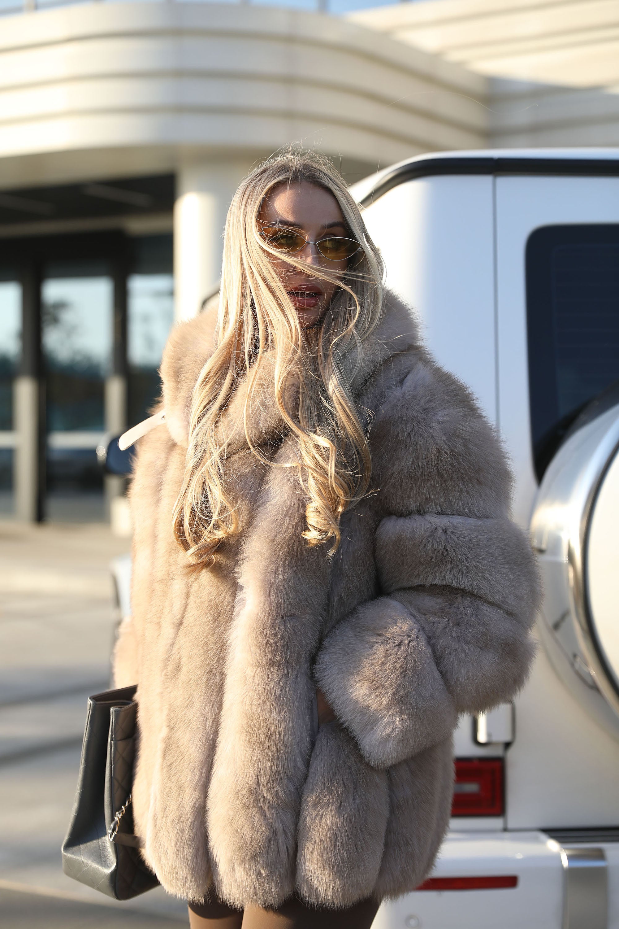 Women's Vertical-Stripe Fox Fur Oversized Coat with Banded Sleeves & Lapel Collar — Downtown Rhythm