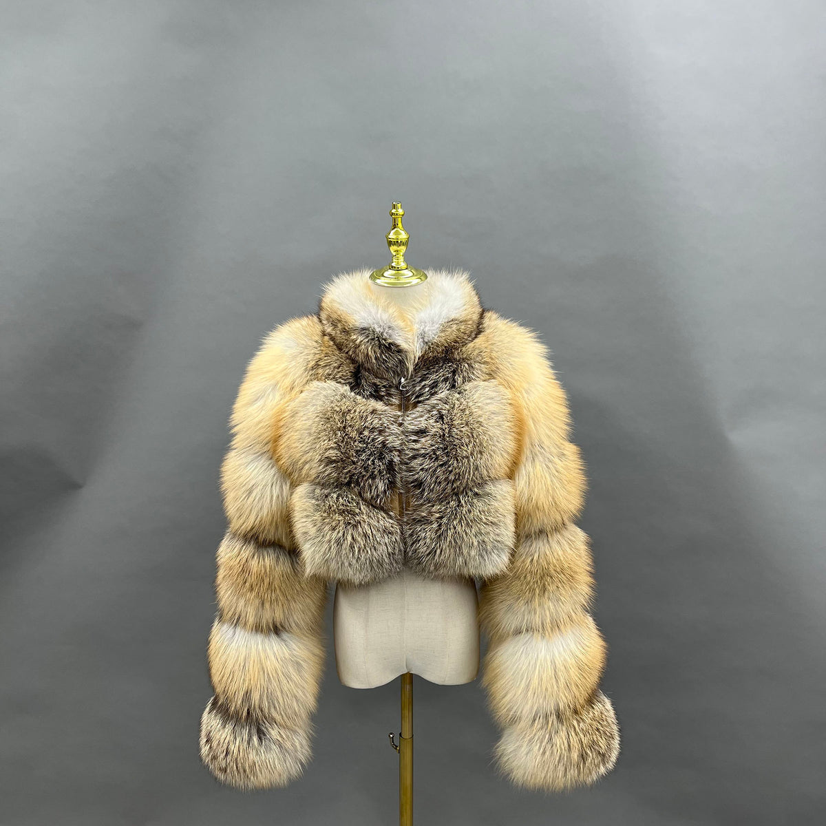 Golden fox fur cropped jacket — back view on mannequin stand