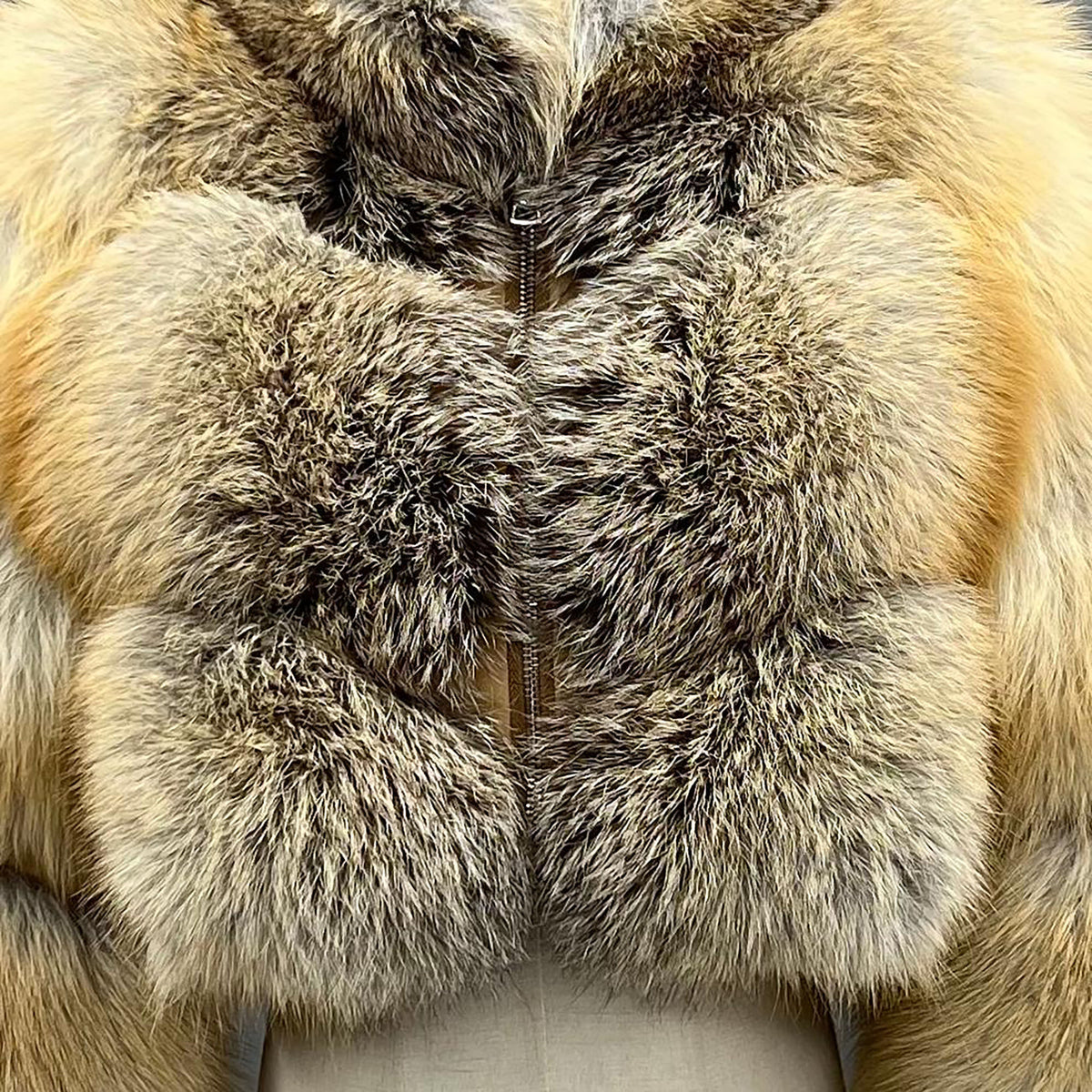 Golden fox fur cropped jacket — model wearing in bar setting